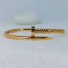 industrial-edge-nail-design-gold-bangle