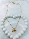 gilded-ribbons-textured-bow-pendant-necklace